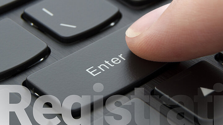 Finger is pressing "Enter" key.